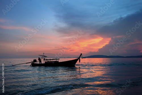 fishing boat on the background of a colorful beautiful sunset. Krabi. Thailand. Paradise rest. Relaxation