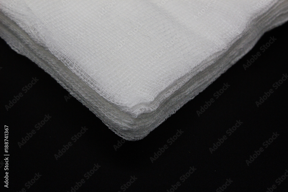 White medical cotton gauze on black background White medical cotton gauze on black background