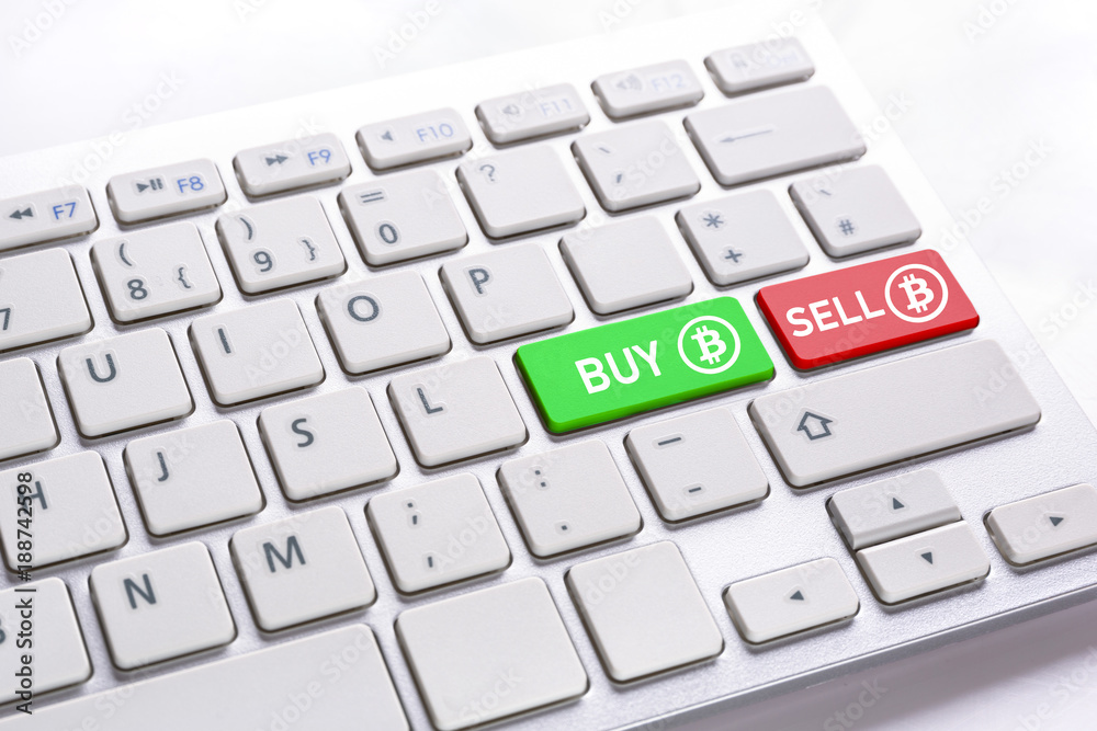 Computer keyboard with BUY and SELL bitcoin buttons. Computer keyboard with BUY and SELL bitcoin buttons.