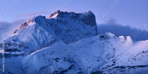 Bure Peak (Pic de Bure) in the Devoluy Mountain range at dusk in Winter. Hautes-Alpes, French Alps, France