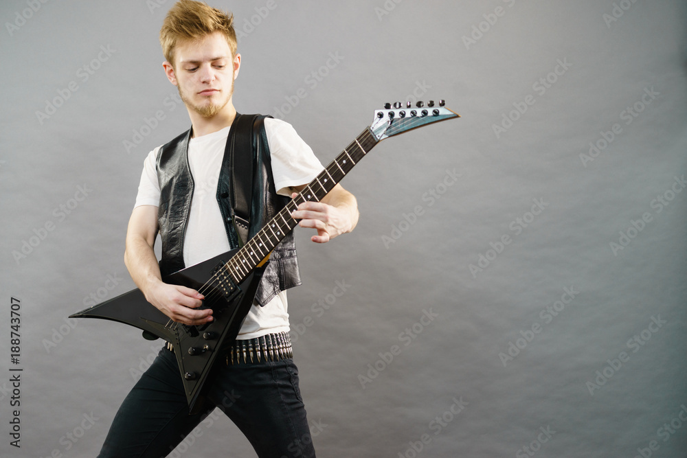 Fototapeta premium Man playing on electric guitar