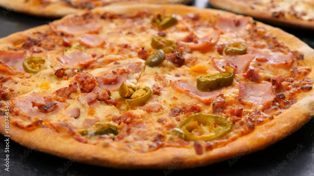 Dolly parallax shot of home made pizza with jalapeno Dolly parallax shot of home made pizza with jalapeno