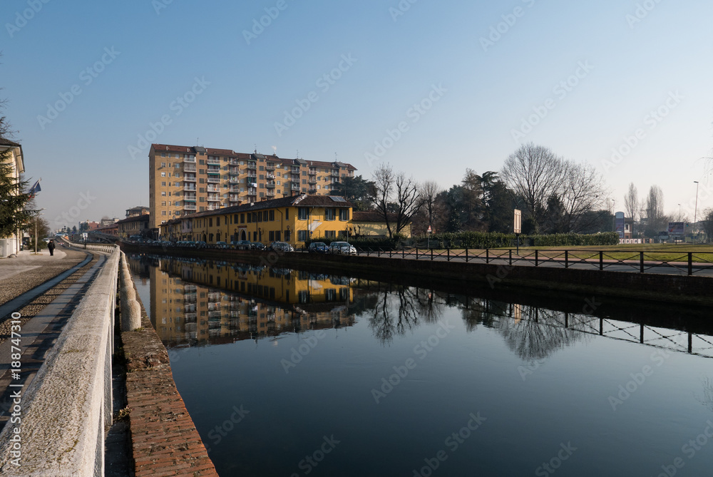 view of Trezzano sul naviglio reflected on the canal
