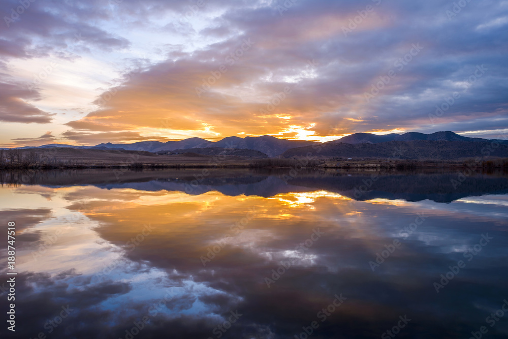Sunset Mountain Lake - Colorful winter sunset at Bear Creek Lake, Denver-Lakewood, Colorado, USA.