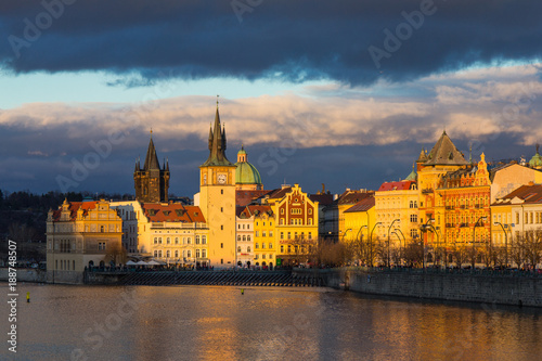 Beautiful night view of the Charles Bridge  the Old Town Bridge Tower  and the Old Water Tower  the Smetana Embankment and the Prague Beer Museum in Czech Republic New Year s Eve