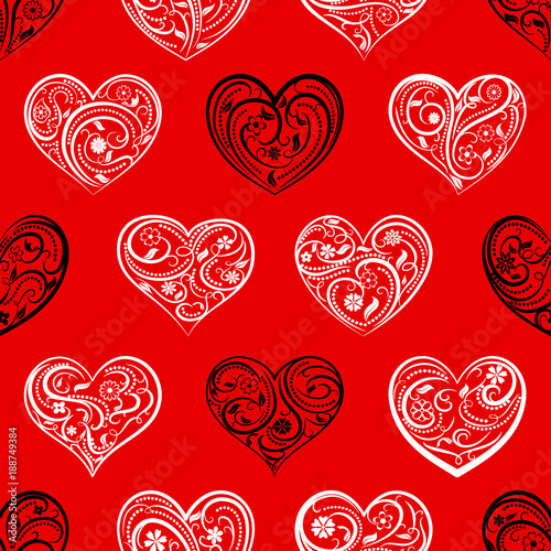 Seamless pattern of big hearts with ornament of curls, flowers and leaves, white and black on red