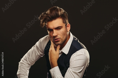 Fotografie Portrait od handsome man in studio on dark background
