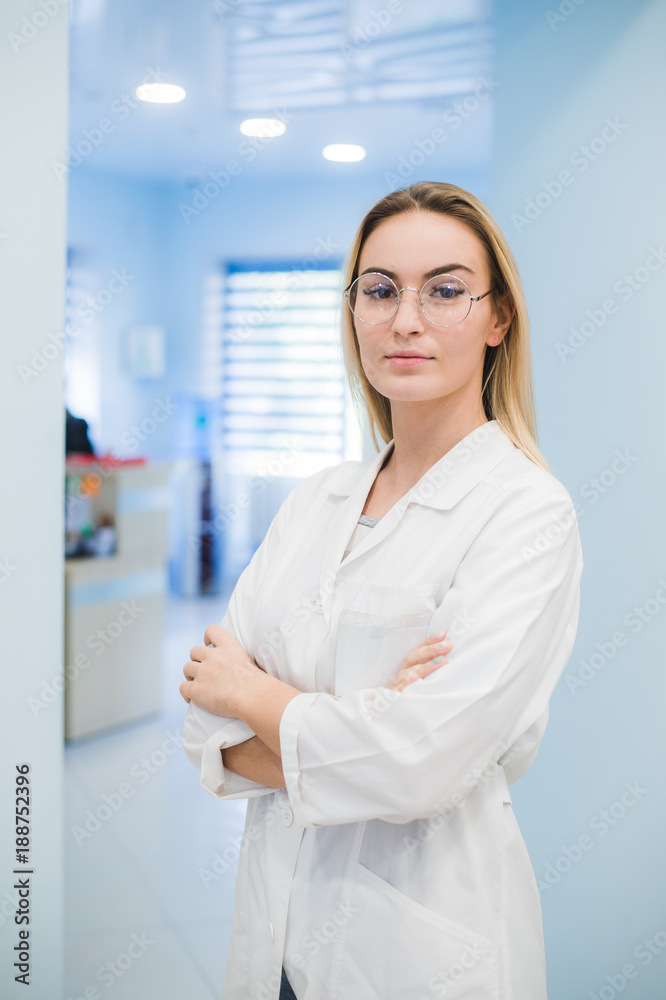 Happy smiling cheerful young medical doctor woman in the office
