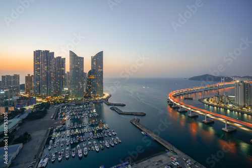 Busan city skyline view at Haeundae district  Gwangalli Beach with yacht pier at Busan  South Korea.