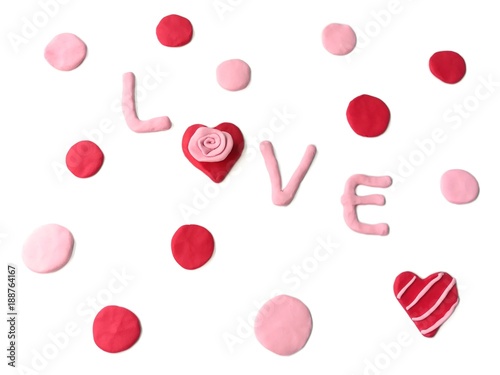 Bild auf Leinwand Sweet colored plasticine clay made are red dots and pink arranged around the lov