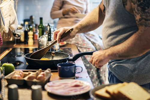 Man cooking breakfast in the kitchen