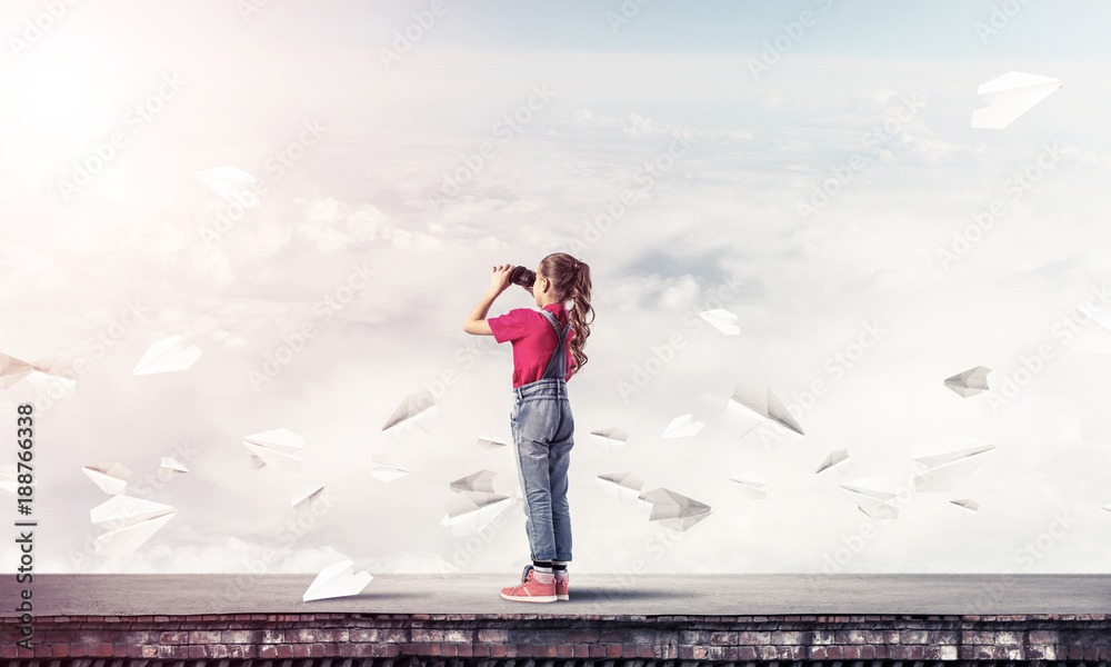 Concept of careless happy childhood with girl of school age look