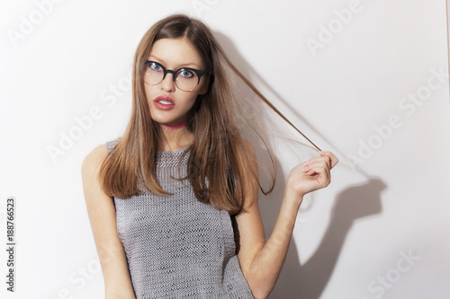 Beautiful surprised young girl wearing eyeglasses