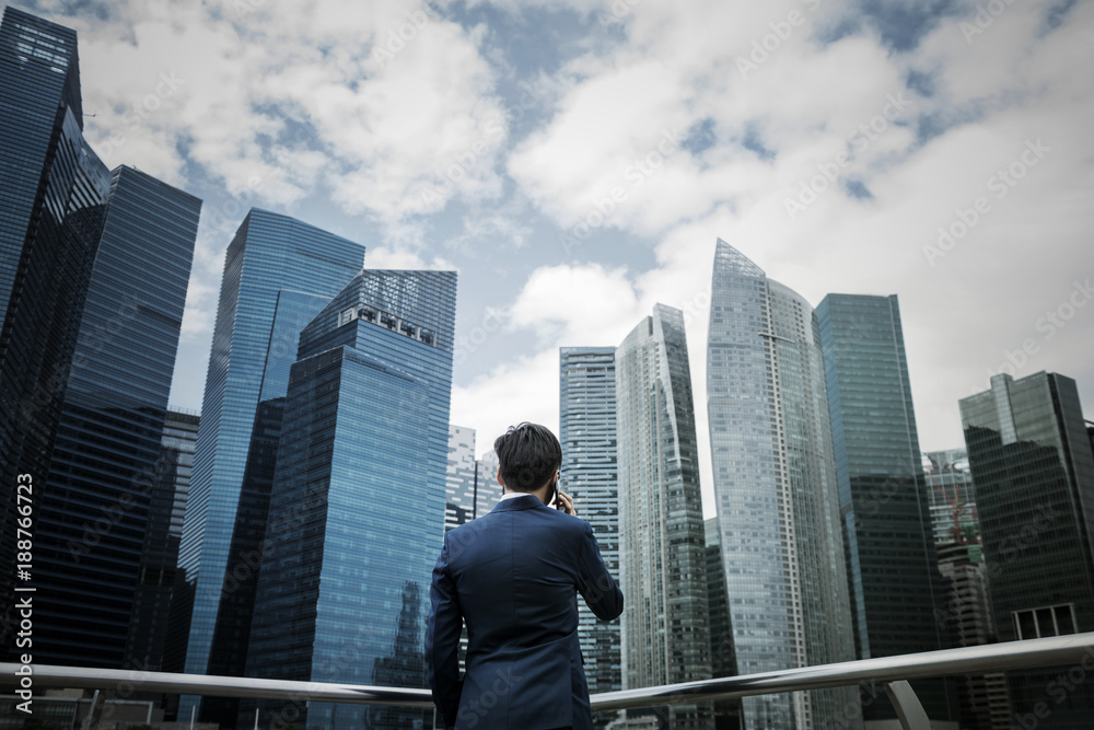 Asian businessman in a city Asian businessman in a city