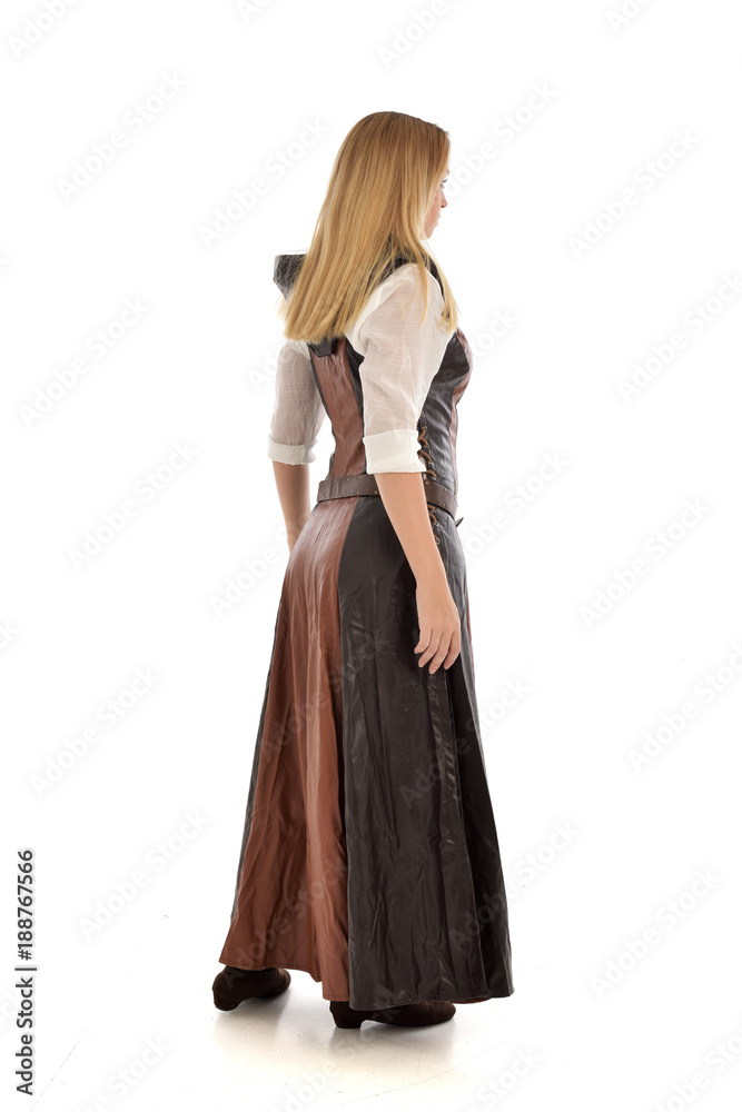full length portrait of girl wearing brown  fantasy costume.. standing pose with back to the camera on white studio background. 