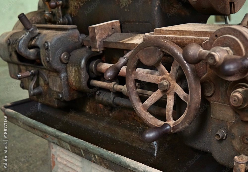 Grain Image: Close up of old machine factory made of steel and used in the past. Broken and rustic machine left over in abandon factory. Image of aged equipment with rust and gear part. Grain Image: Close up of old machine factory made of steel and used in the past. Broken and rustic machine left over in abandon factory. Image of aged equipment with rust and gear part.