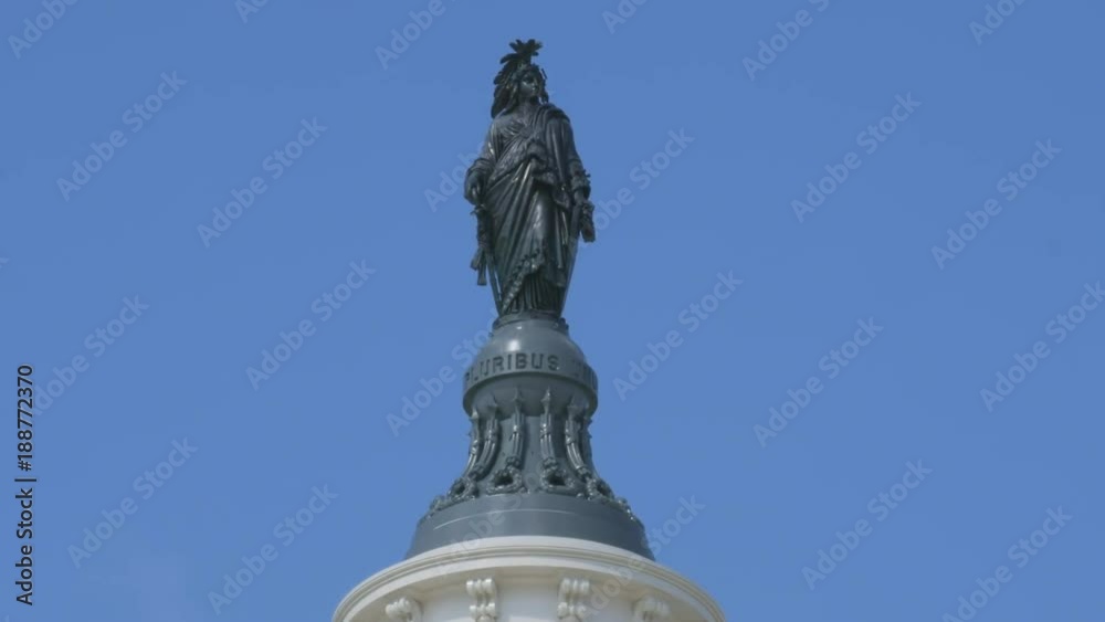 close up tilt down shot of freedom statue on the us capitol building in washington d.c.