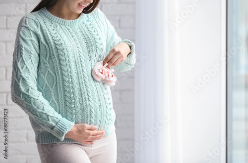 Pregnant woman with cute ba...