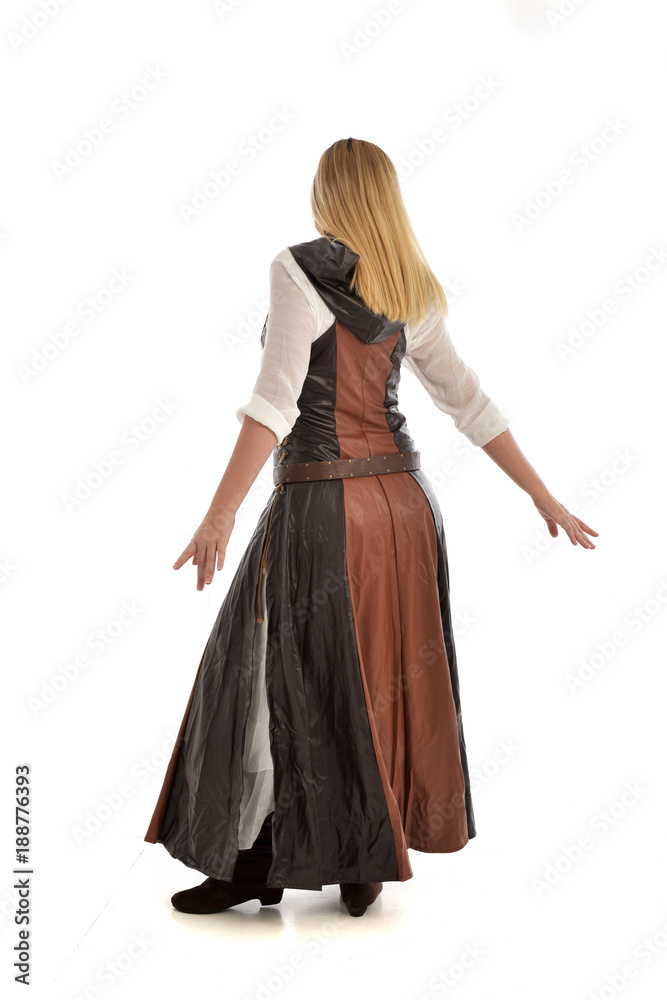 full length portrait of girl wearing brown  fantasy costume, standing pose with back to the camera on white studio background. 