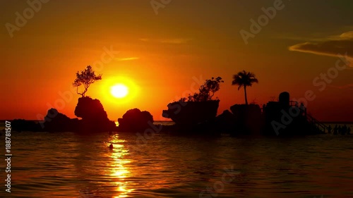 Swimmer Silhouette & Sunset Over Boracay Rock; White Beach Afternoon; Boracay Island, Philippines