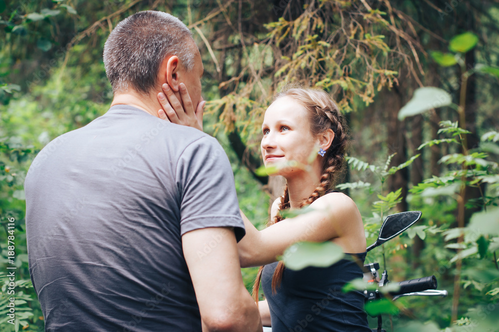 The motorcyclist and the girl in the forest The motorcyclist and the girl in the forest