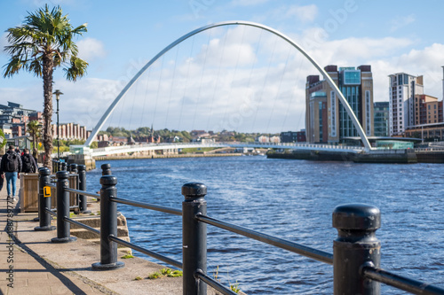 Quayside along Tyne River, in Newcastle. With blurred image of building and Gateshead Millennium Bridge on background