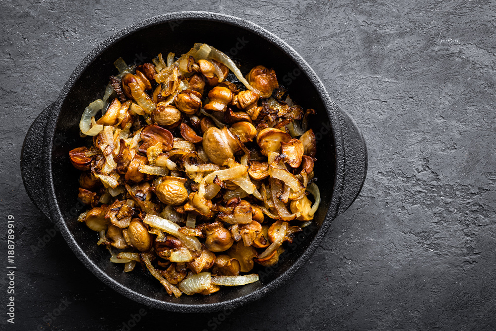Mushrooms fried with onion, top view Mushrooms fried with onion, top view