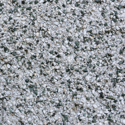 Wall with small stones as texture background.