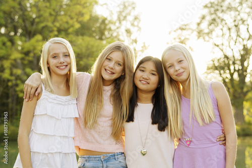 Portrait of four girls in park