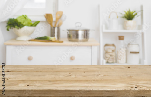 Table top with blurred kitchen furniture as background