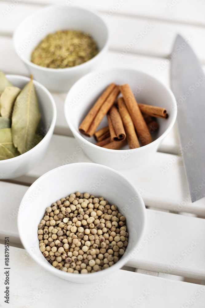 Bowls of cinnamon sticks,åÊbay leaves and peppercorns Bowls of cinnamon sticks,åÊbay leaves and peppercorns