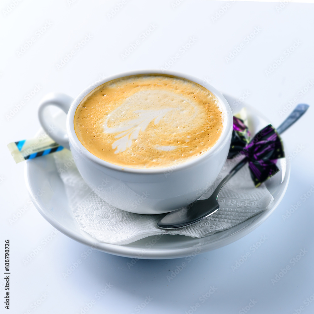 Delicious hot latte coffee with art in a white cup Delicious hot latte coffee with art in a white cup