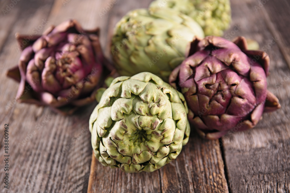 artichoke on wood background artichoke on wood background