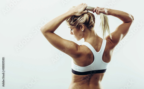 Wallpaper Mural Back view of young healthy athlete woman. Young healthy athlete female posing at studio Torontodigital.ca