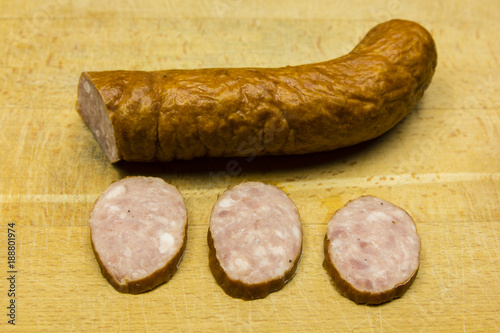 Three slices of sausage cut.