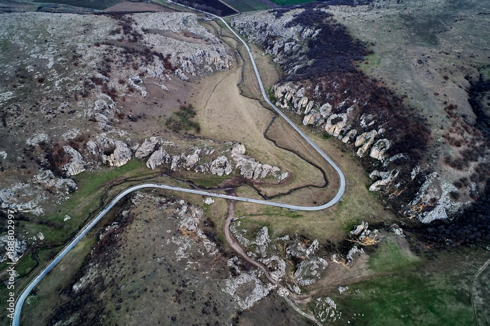 mountain landscape with some of the oldest limestone rock formations in Europe in Dobrogea Gorges (Cheile Dobrogei) Romania mountain landscape with some of the oldest limestone rock formations in Europe in Dobrogea Gorges (Cheile Dobrogei) Romania