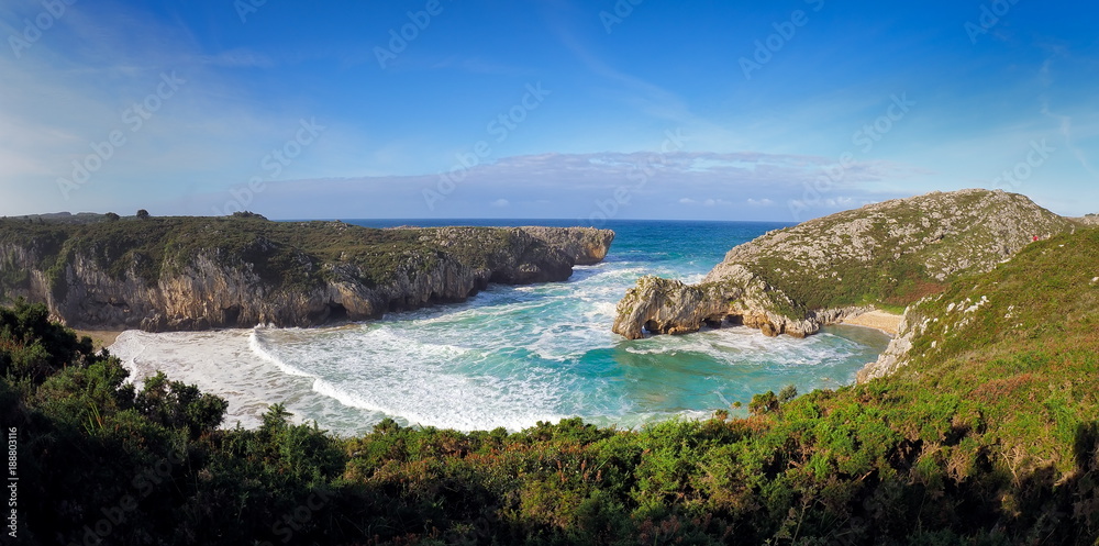 Beautiful stone arches on Playa de las Cuevas del Mar, Cantabria, Spain