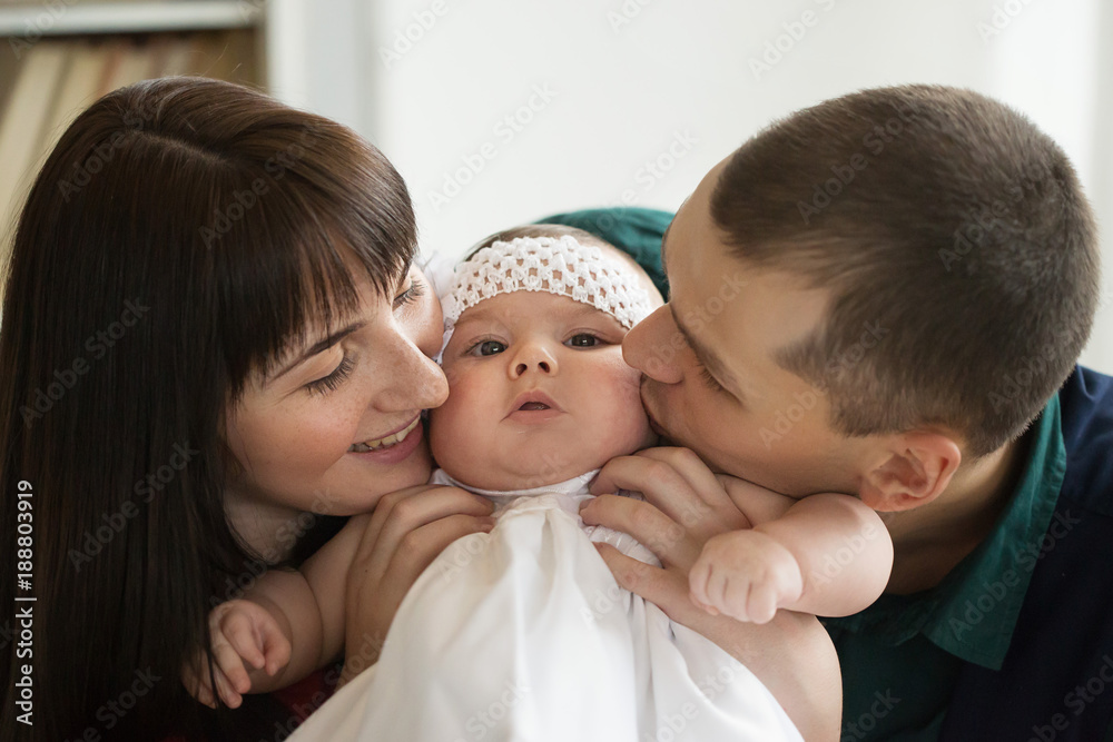 father, mother and child. A married couple with a six-month-old daughter. a family. father, mother and child. A married couple with a six-month-old daughter. a family.