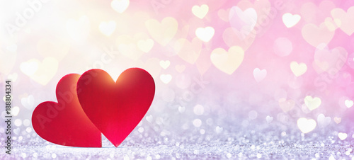Valentine's Day background. Abstract red hearts in sunlight 