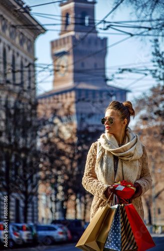 tourist woman near Sforza Castle in Milan, Italy looking aside