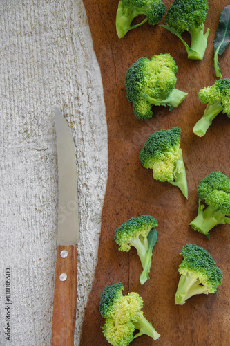 
Top view of fresh green broccoli on wooden table. Healthy eatng concept photo