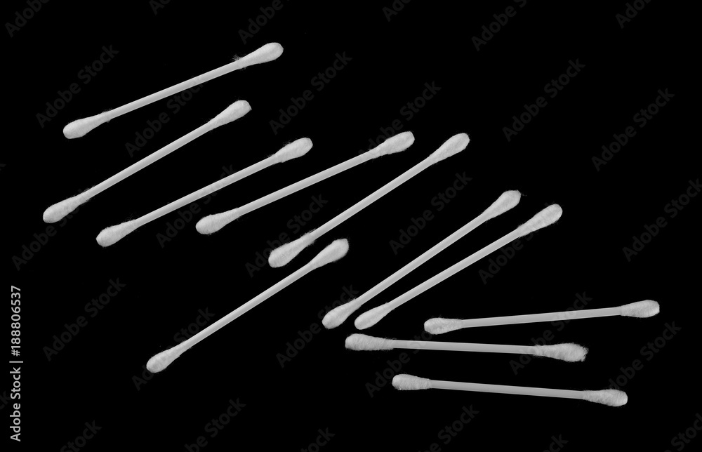 Cotton swabs set isolated on black background, top view Cotton swabs set isolated on black background, top view