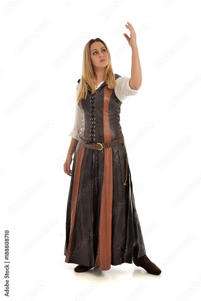 full length portrait of girl wearing brown  fantasy costume. standing pose on white studio background. 