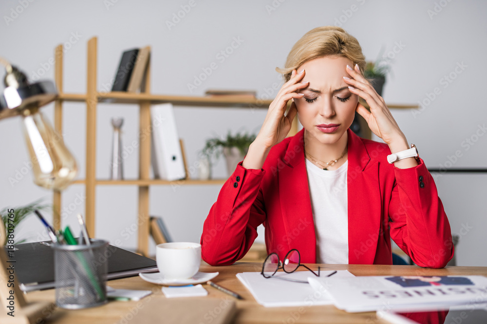 portrait of overworked businesswoman sitting at workplace in office portrait of overworked businesswoman sitting at workplace in office