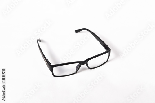black glasses in plastic frame with clear lenses on white background isolate