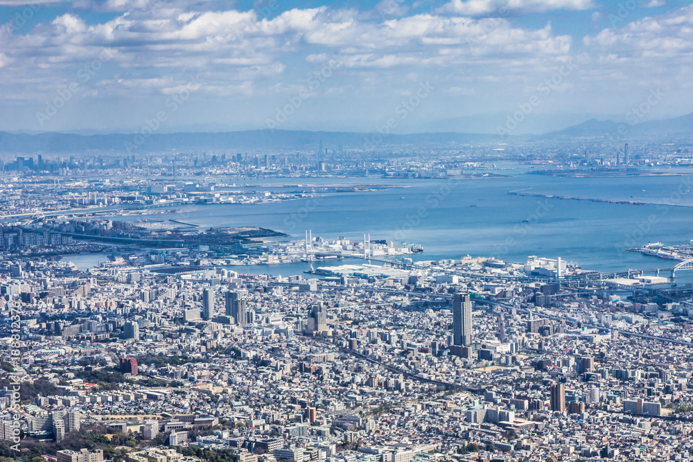 Kobe city in Japan. Modern populous cityscape background.
