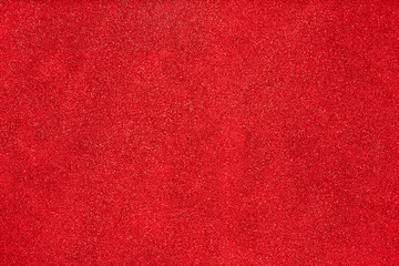 Aerial, top view of red glitter background