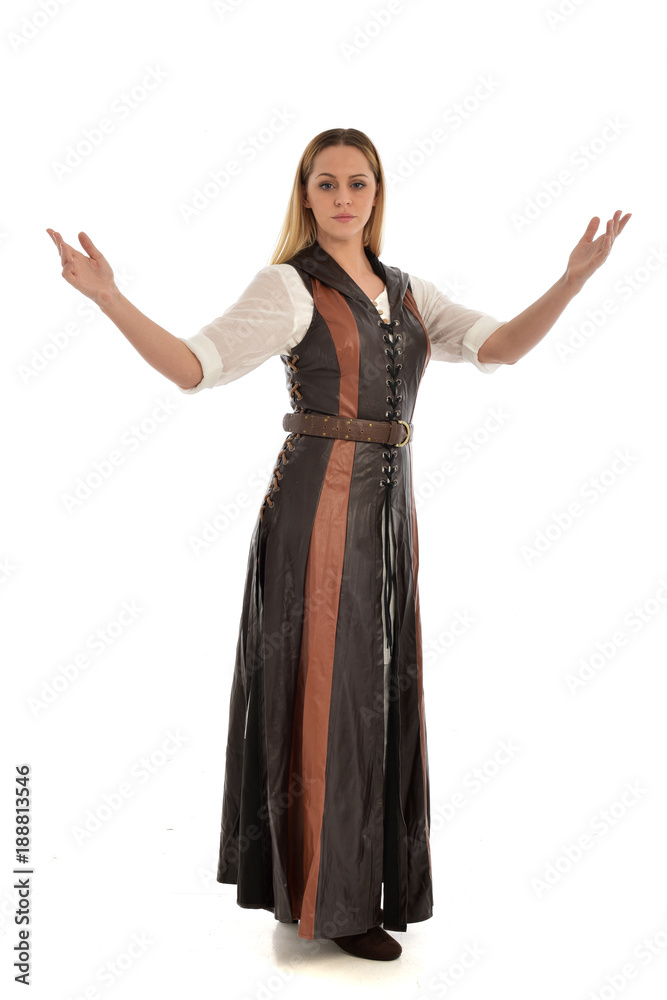 full length portrait of girl wearing brown  fantasy costume. standing pose on white studio background. 