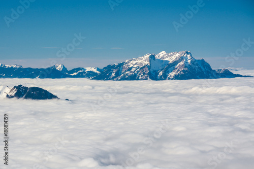 Mount Pilatus rising above the dense clouds in Alps