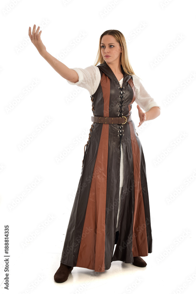 full length portrait of girl wearing brown  fantasy costume. standing pose on white studio background. 